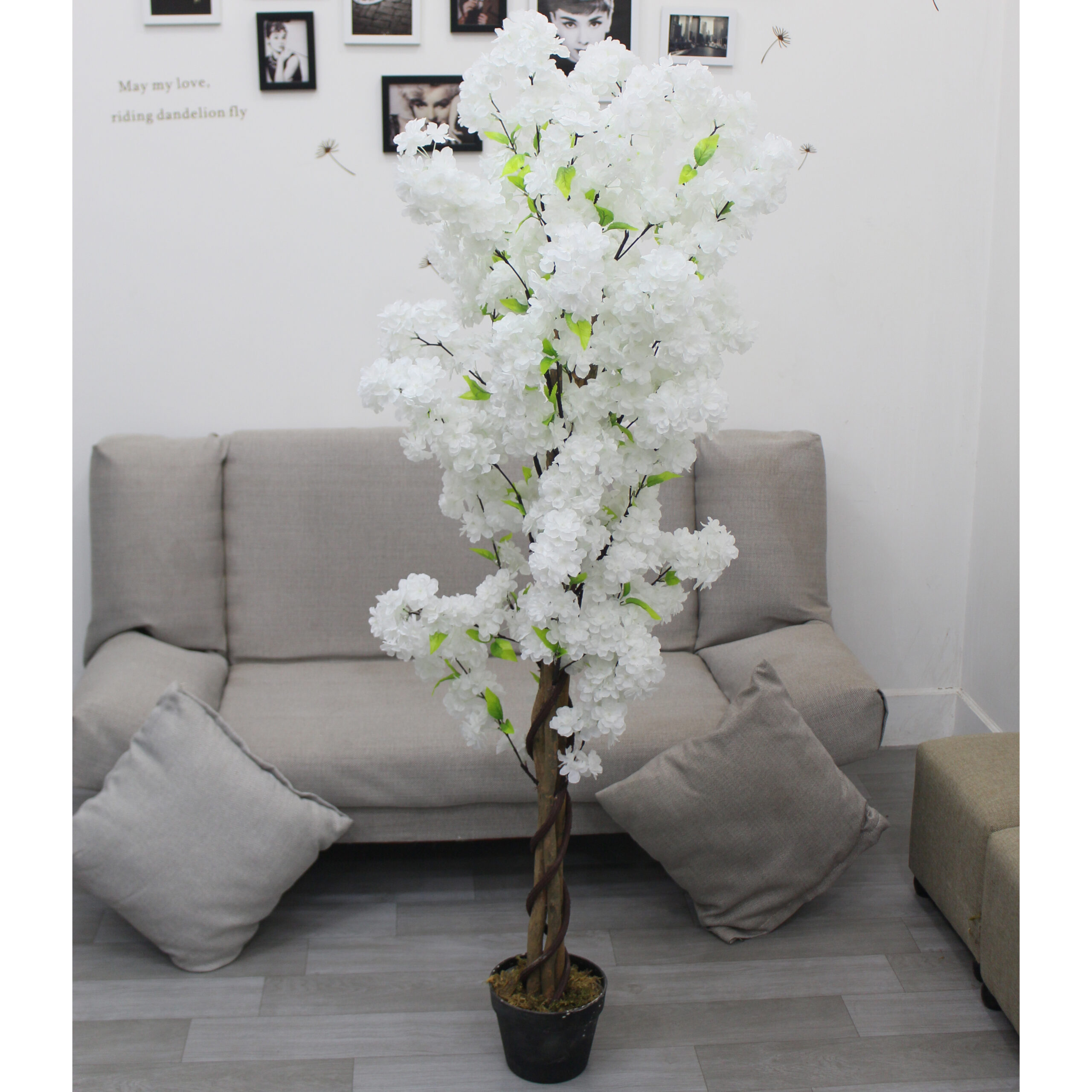 artificial flowering plant in a pot styled in a modern Nigerian living room