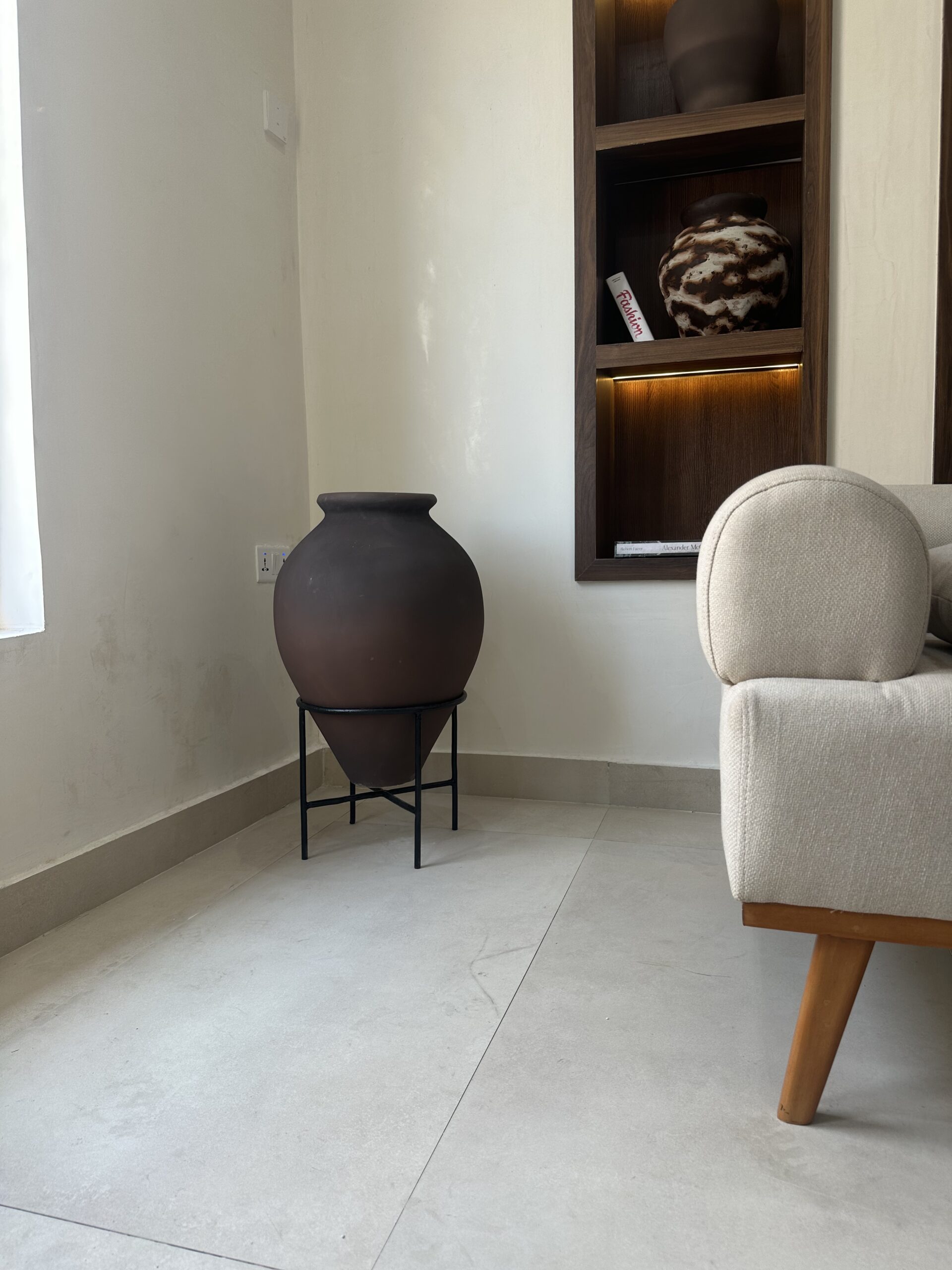 Chrome Brown Ampora Pot on a sleek stand, styled with natural twigs, bringing earthy warmth and modern elegance to biophilic home décor.