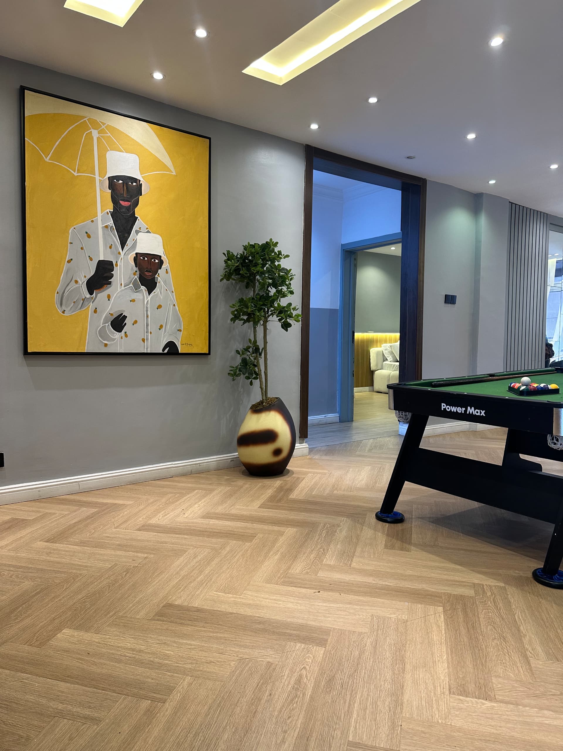 Sophisticated smoked mango flower pots paired with twisted cedar at the entryway, delivering an inviting and luxurious welcome — Oriental Effect Nigeria.