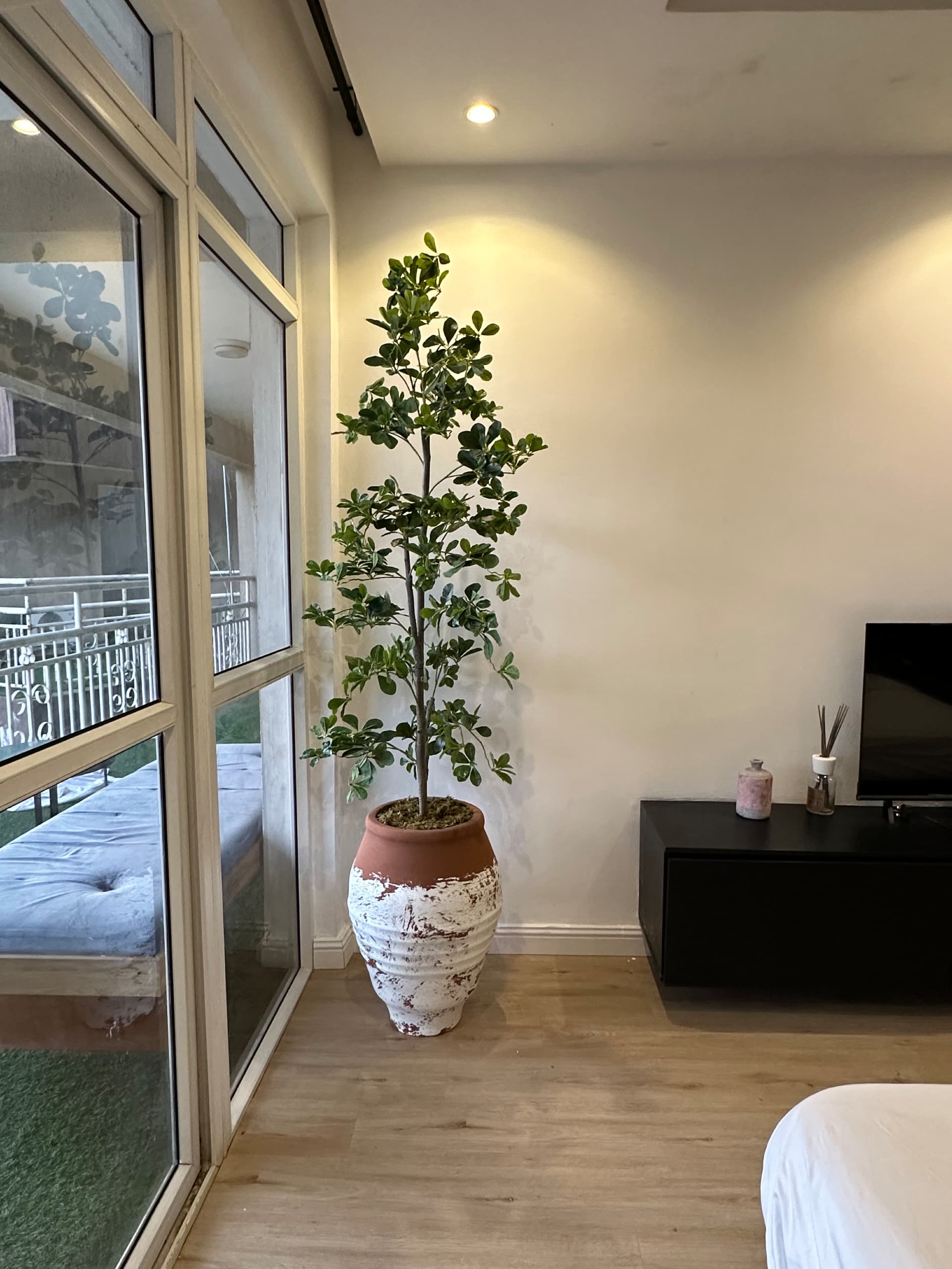 terracotta-inspired antique pots with brown wash finish styled in a bedroom interior