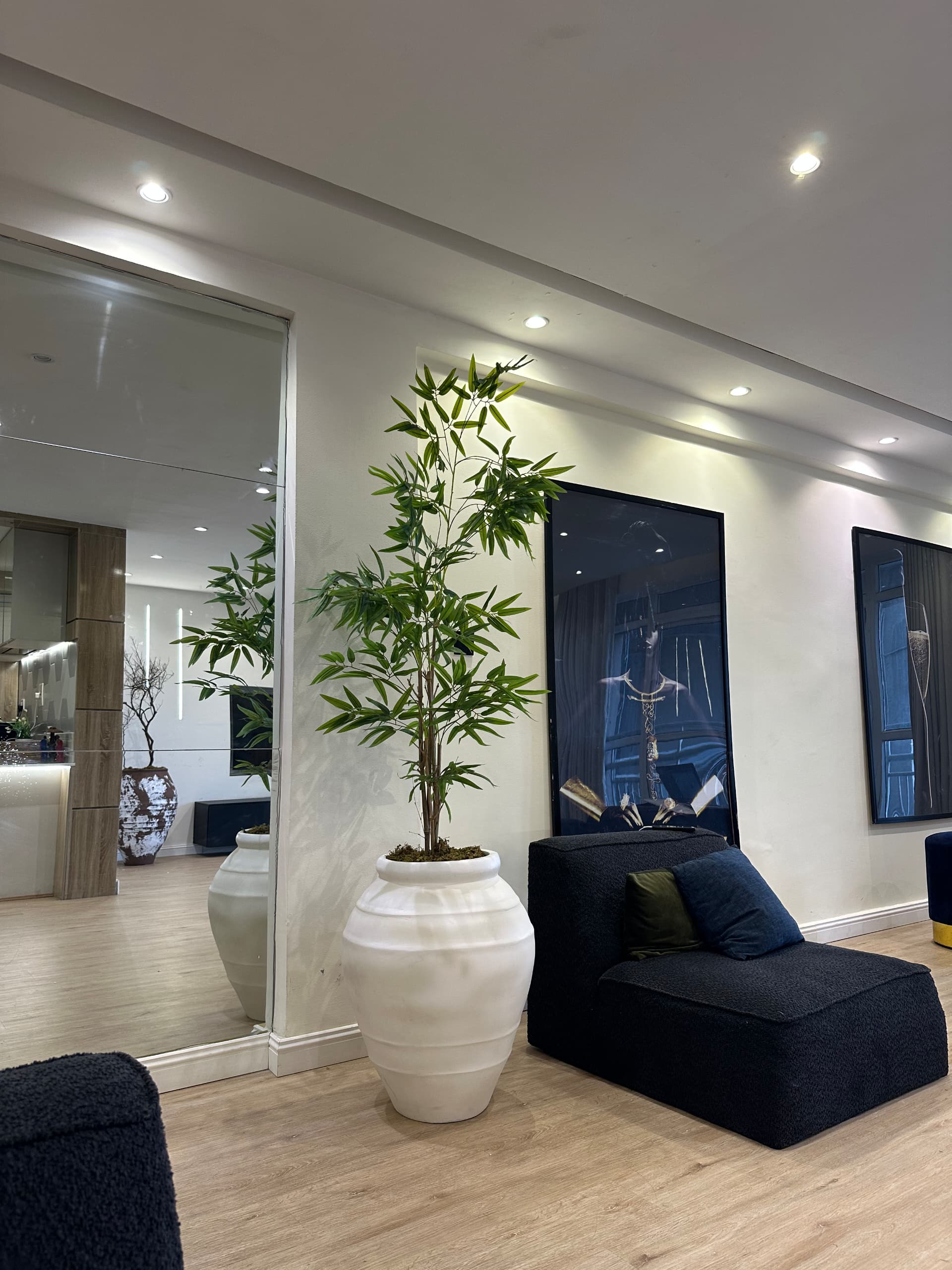 terracotta-inspired antique pots styled with artificial olive tree in a Nigerian living room