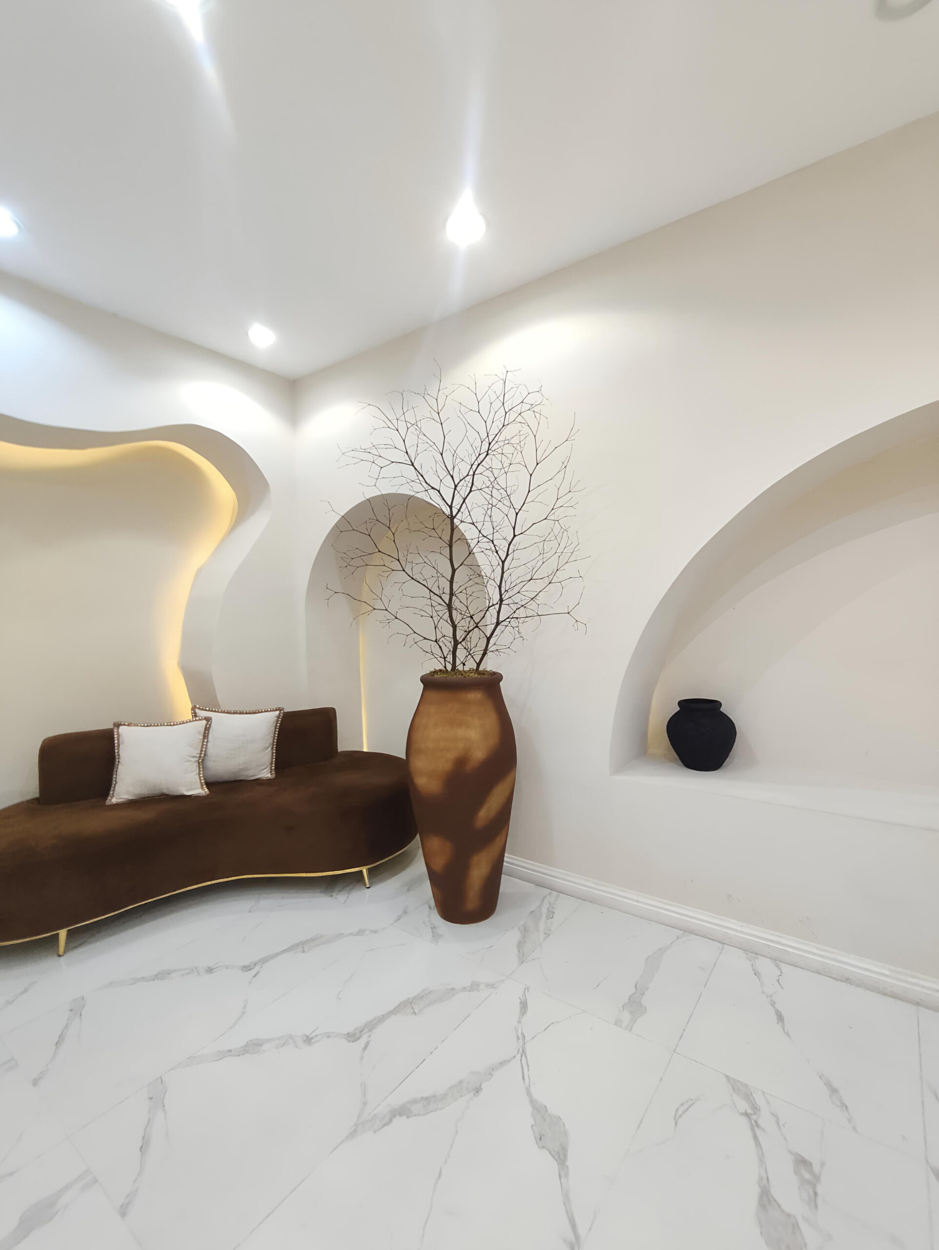 terracotta-inspired antique pots styled with twigs in a creative studio space

Shelves & Tabletops