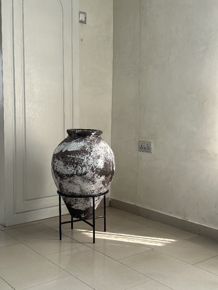 rustic terracotta antique pots with aged textures for Afrohemian Nigerian interiors