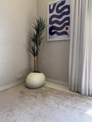Modern Artificial Slim Yucca Plant with textured pale shoe planter for home and office interiors