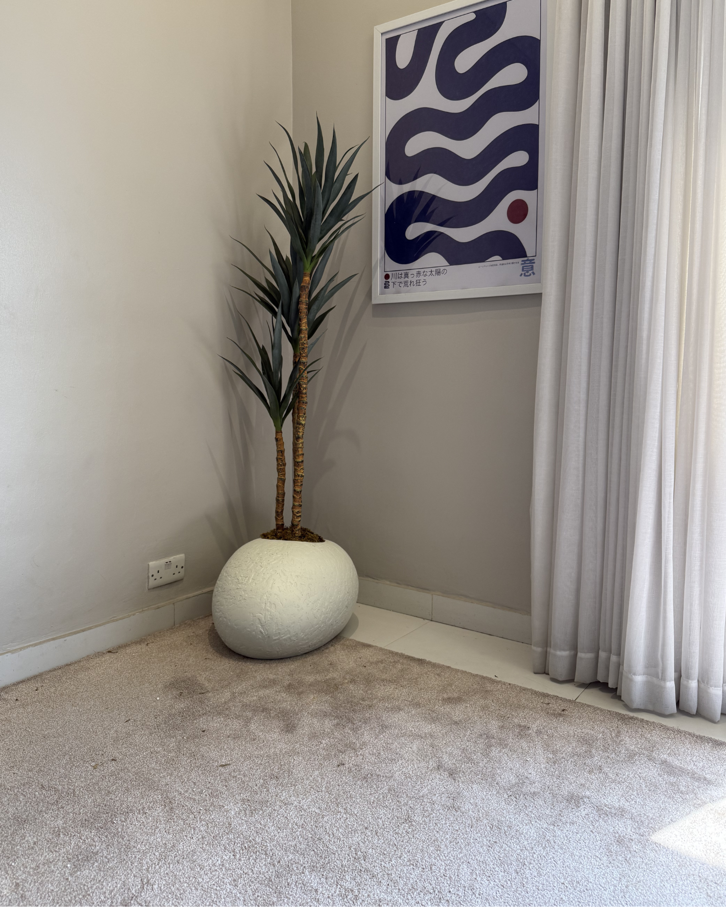 Modern Artificial Slim Yucca Plant with textured pale shoe planter for home and office interiors