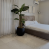 Artificial Monstera Plant Artificial monstera plant in Nigeria styled in Matte Black Merlot Pot