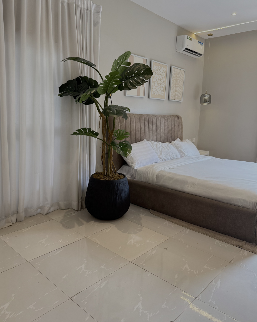 Artificial Monstera Plant Artificial monstera plant in Nigeria styled in Matte Black Merlot Pot