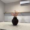 Decorative Vase with Artificial Plant in Nigeria Mini Cherry Plant in textured Medina Vase