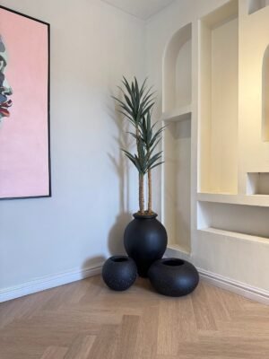 Matte Black Ampora Pot Paired with Granite Small and Flat Orbis Pots, Styled with Artificial Slim Yucca Tree Matte Black Ampora Pot Paired with Granite Small and Flat Orbis Pots, Styled with Artificial Slim Yucca Tree